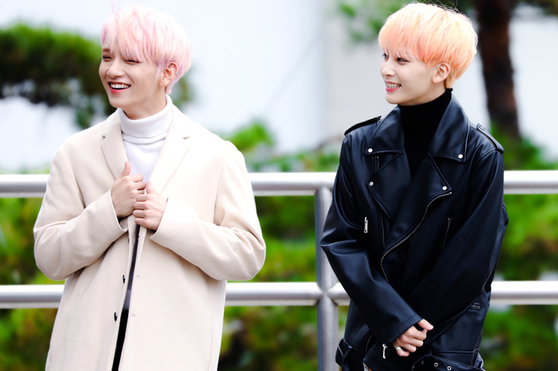 SEVENTEEN members Joshua and Jeonghan smiling outdoors at a 2017 fan event